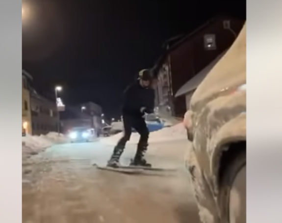 Скијао по улици закачен за ауто (ВИДФЕО)